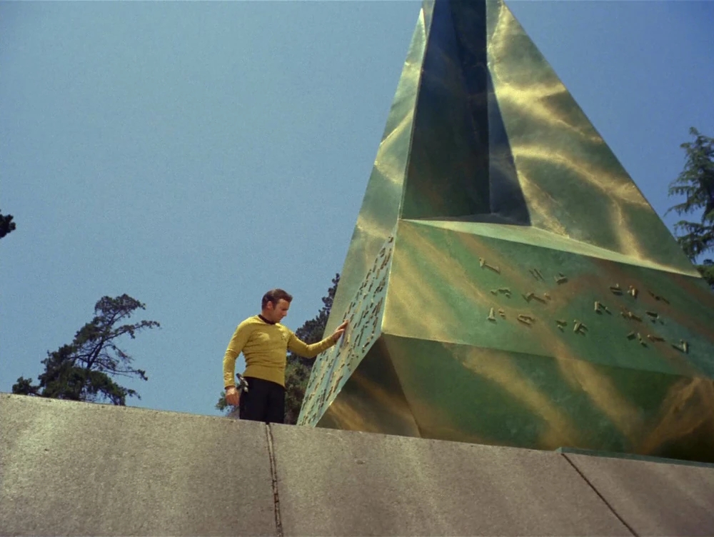 Captain Kirk with an obelisk.